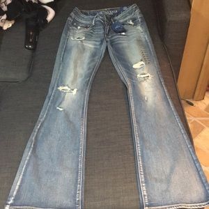 Brand new denim jeans with tags on them. Size 6.
